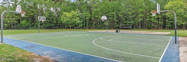 view of sport court with a lawn and volleyball court