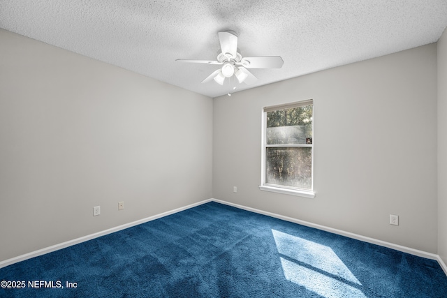 carpeted empty room featuring a textured ceiling and ceiling fan