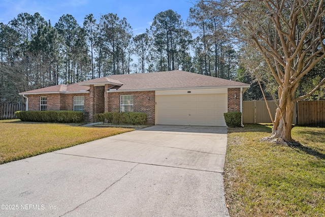 ranch-style house with a garage and a front yard