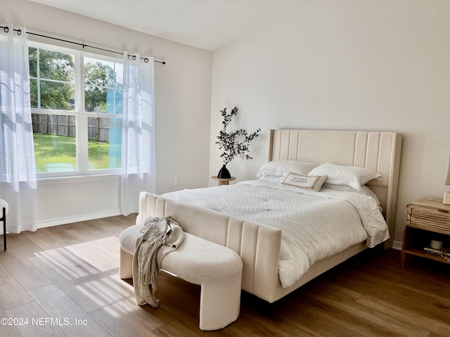 bedroom with wood-type flooring