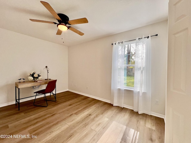 office with hardwood / wood-style floors and ceiling fan