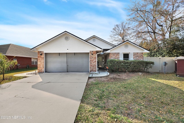 ranch-style home with a garage and a front lawn