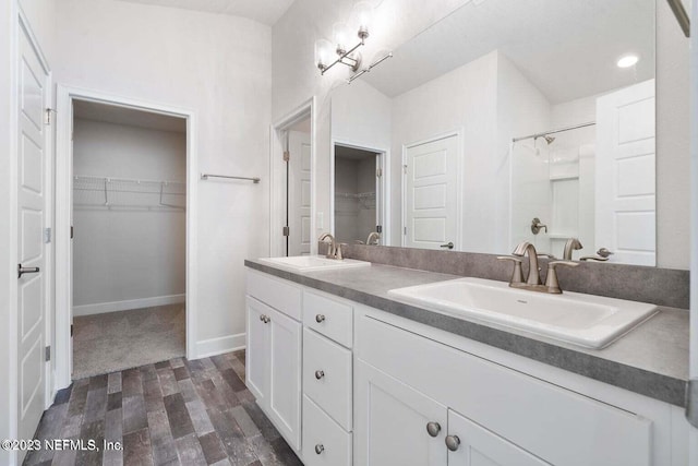 bathroom with walk in shower, vanity, wood-type flooring, and a notable chandelier