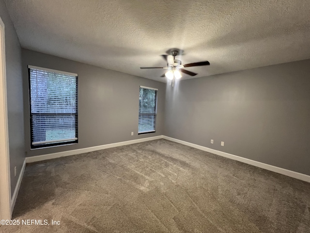 spare room with carpet, a textured ceiling, and ceiling fan