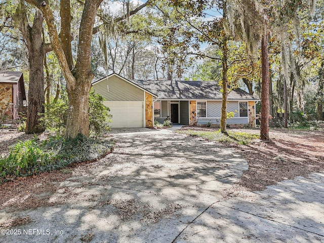 ranch-style home with a garage