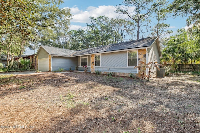 ranch-style house featuring a garage