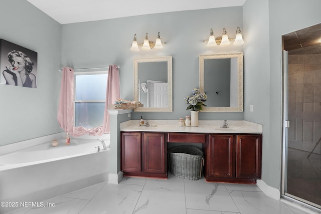 bathroom with vanity and separate shower and tub