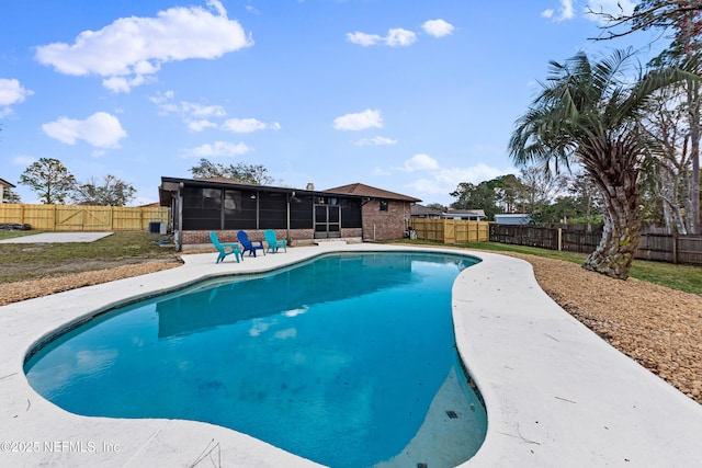 view of swimming pool with a sunroom