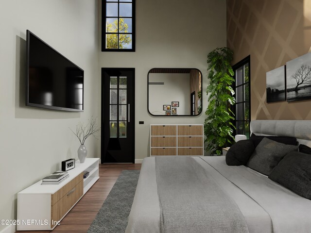 bedroom with dark hardwood / wood-style floors