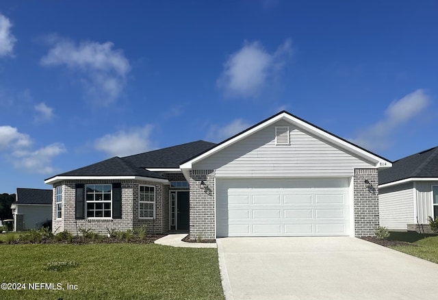 ranch-style house with a garage and a front lawn