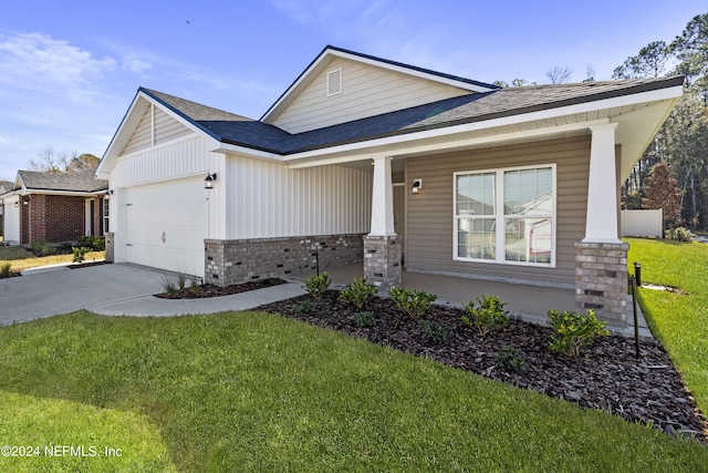 view of front of property with a garage and a front yard