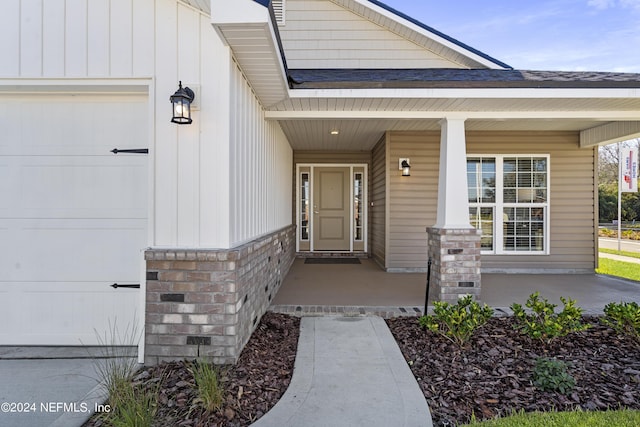 doorway to property featuring covered porch