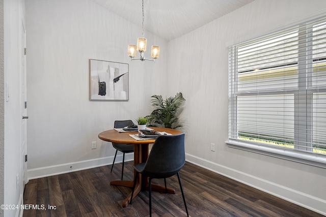 dining room featuring lofted ceiling, dark hardwood / wood-style flooring, a healthy amount of sunlight, and an inviting chandelier