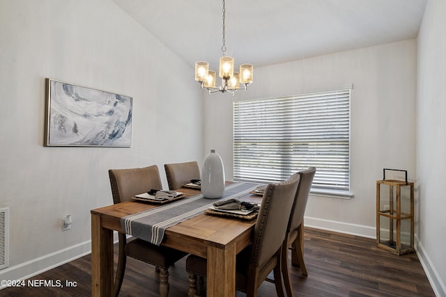 dining room featuring dark wood-type flooring and an inviting chandelier