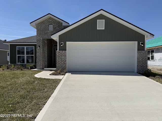 8284 Helmsley Blvd, Jacksonville, FL 32219 - single story home featuring brick siding, concrete driveway, a garage, and a front yard