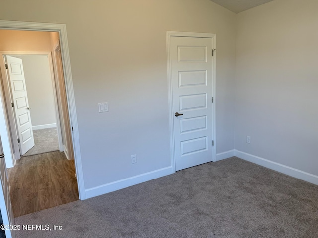 8284 Helmsley Blvd, Jacksonville, FL 32219 - unfurnished bedroom with baseboards and carpet