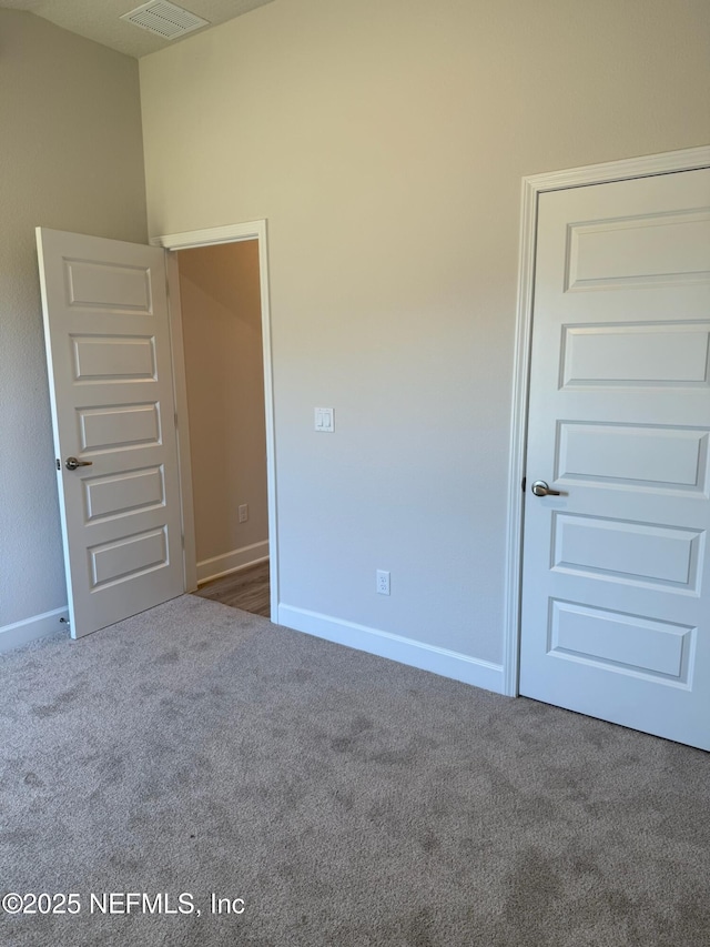 8284 Helmsley Blvd, Jacksonville, FL 32219 - empty room featuring visible vents, baseboards, and carpet floors