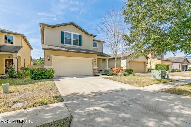 view of property with a garage and a front yard