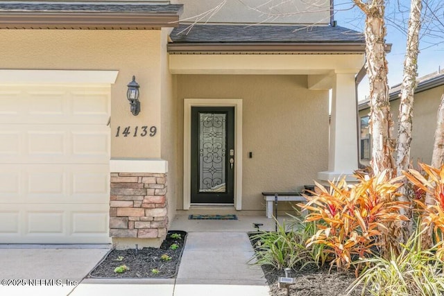 entrance to property featuring a garage