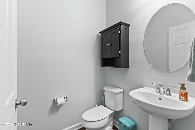 bathroom with sink and toilet