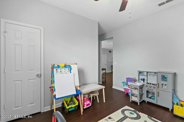 game room featuring dark hardwood / wood-style floors and ceiling fan