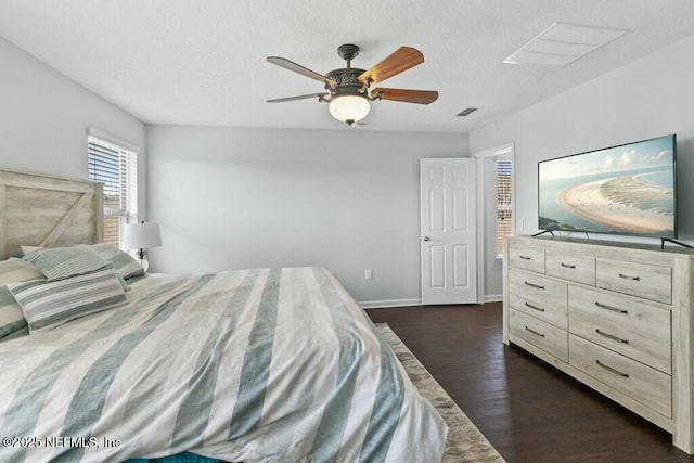 bedroom featuring dark hardwood / wood-style floors and ceiling fan