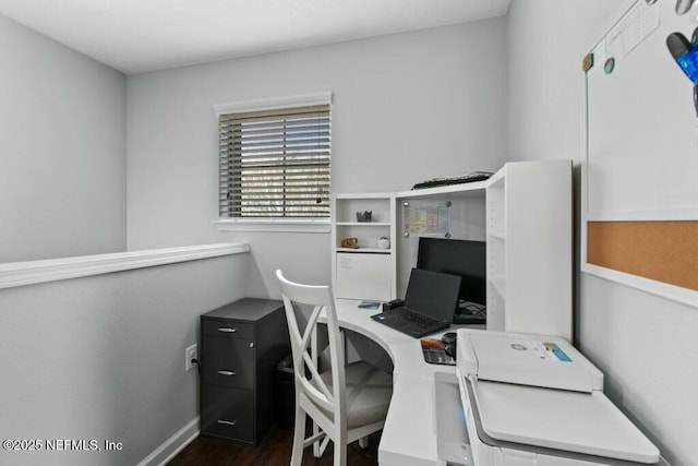 office space with dark wood-type flooring