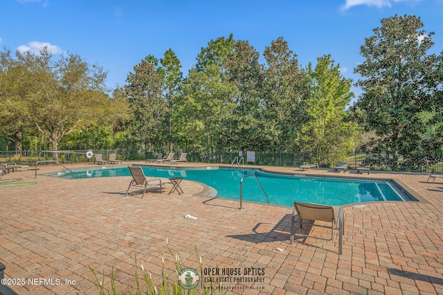 view of swimming pool with a patio area