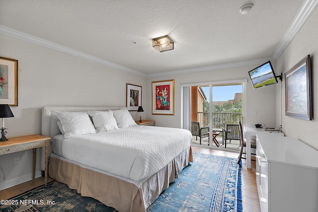 bedroom with a textured ceiling, access to outside, ornamental molding, and wood-type flooring