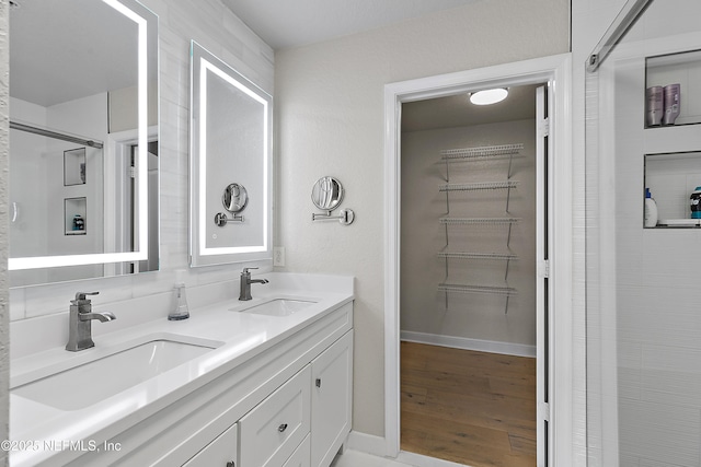 bathroom featuring hardwood / wood-style flooring and vanity