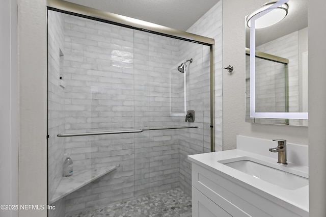 bathroom with vanity and an enclosed shower