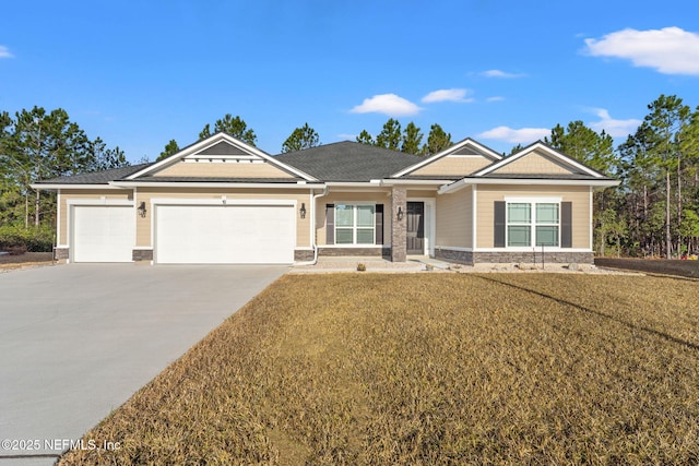 view of front facade with a garage and a front lawn