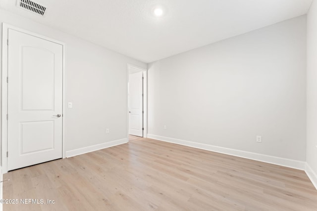 unfurnished room featuring light hardwood / wood-style flooring