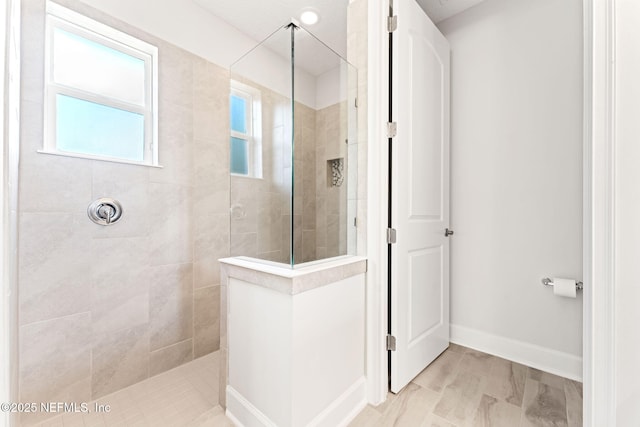 bathroom featuring a tile shower