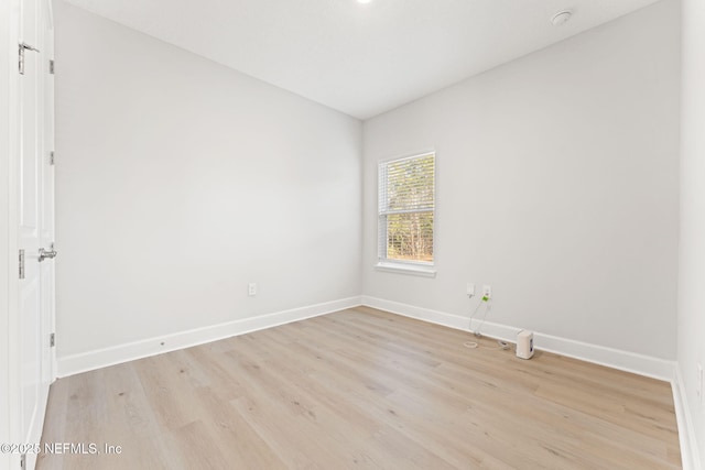 unfurnished room featuring light wood-type flooring