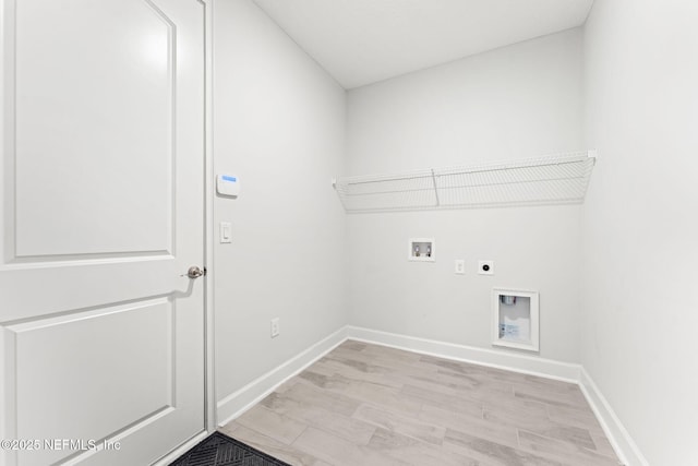 laundry room featuring electric dryer hookup, hookup for a washing machine, and light hardwood / wood-style flooring