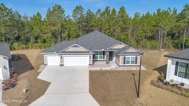 view of front of home with a garage and a front yard