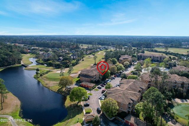 drone / aerial view with a water view and a residential view