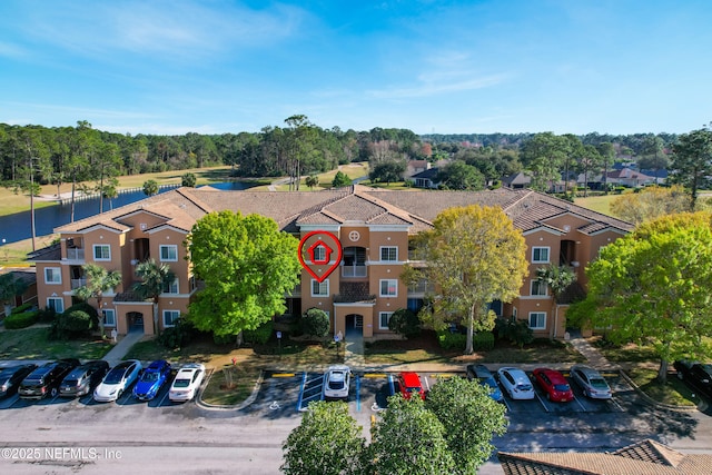 birds eye view of property with a residential view