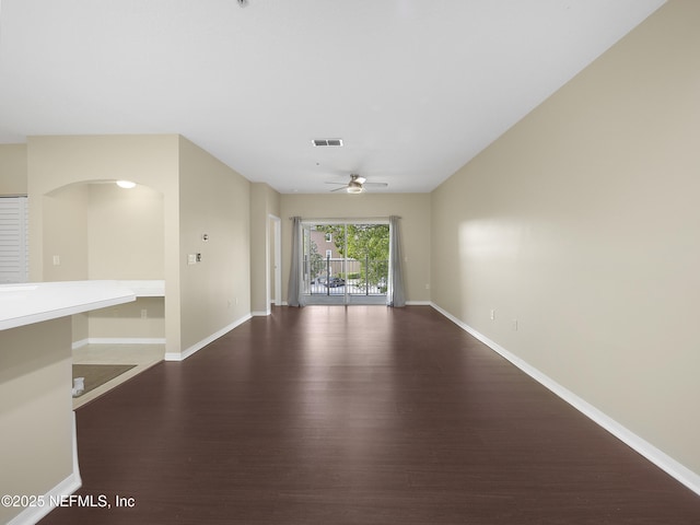 unfurnished room with visible vents, baseboards, and wood finished floors