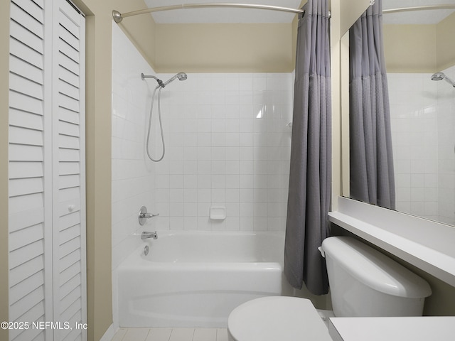 bathroom with shower / tub combo and toilet