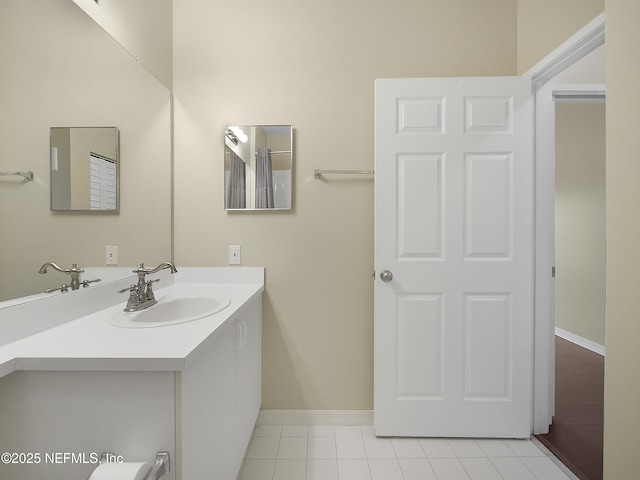 bathroom featuring vanity and baseboards