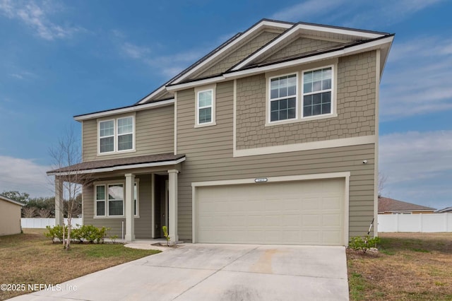 view of front facade with a garage and a front yard