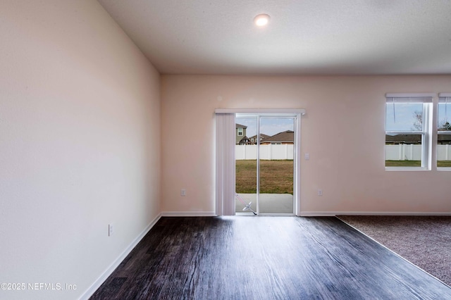 unfurnished room featuring dark hardwood / wood-style floors