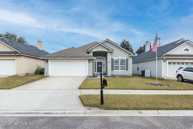 ranch-style home with a garage and a front yard