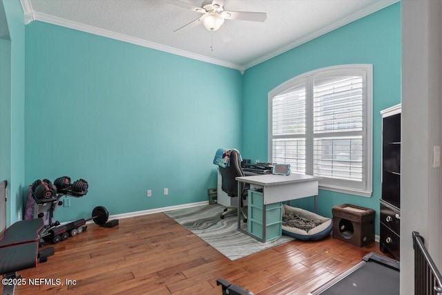 office featuring hardwood / wood-style floors, crown molding, a textured ceiling, and ceiling fan