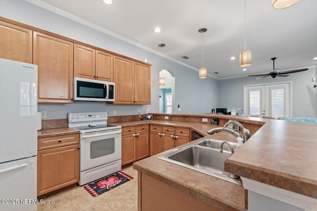 kitchen with sink, crown molding, kitchen peninsula, pendant lighting, and white appliances