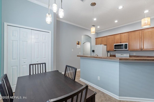 dining room featuring crown molding