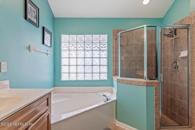 bathroom featuring vanity and separate shower and tub