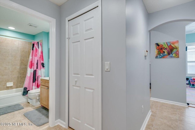 full bathroom with vanity, tile patterned flooring, shower / bath combo, and toilet